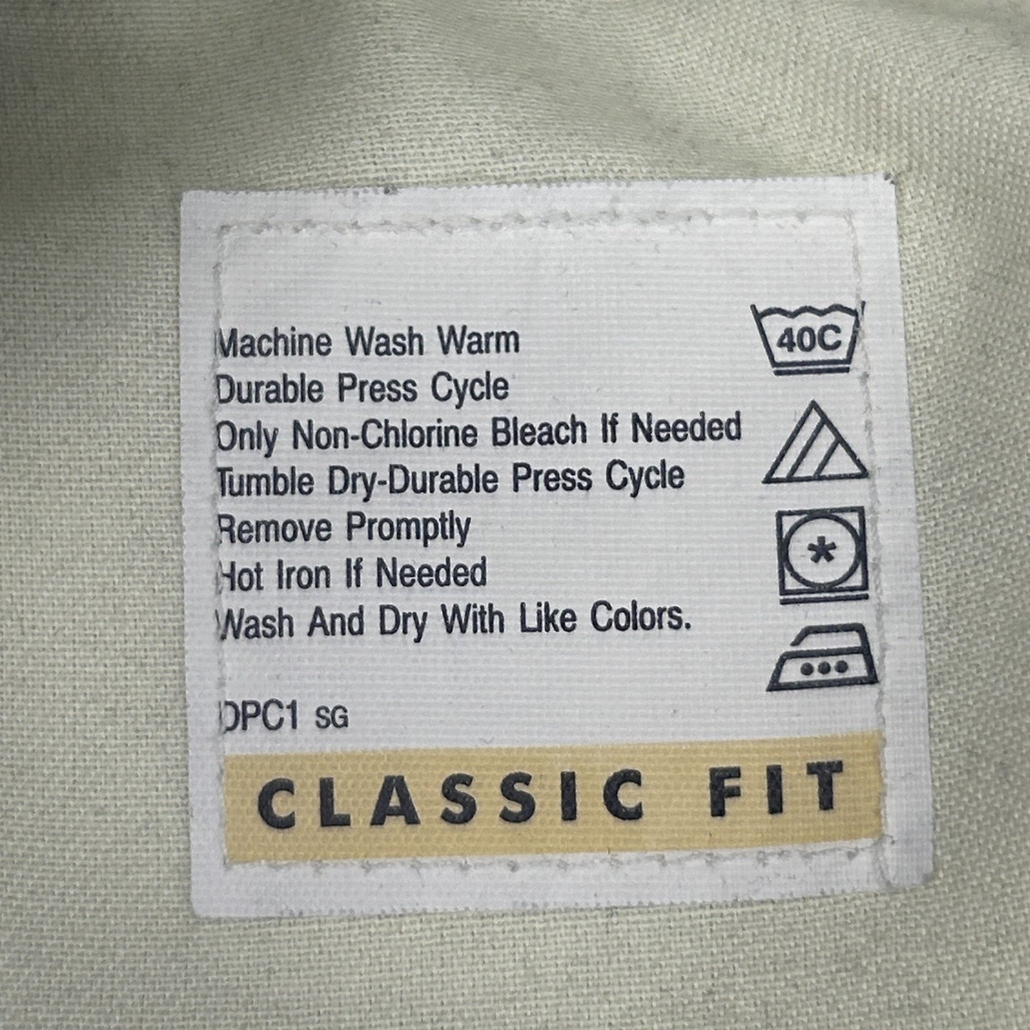 Dockers Classic Fit Khaki Pants in light color with care instructions tag visible