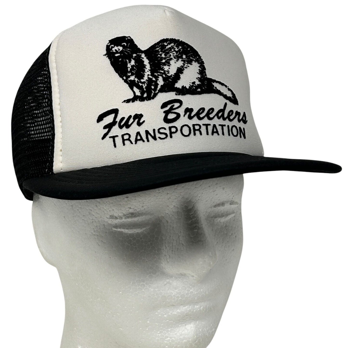 Vintage black and white trucker hat with 'Fur Breeders' logo on front and mesh back for breathable comfort