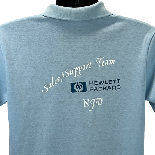 Light blue Hanes polo shirt with embroidered Hewlett Packard logo on the back, size medium