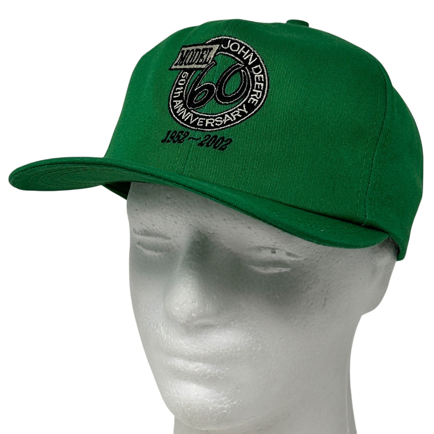 Front view of a green John Deere 60th Anniversary cap with embroidered logo and adjustable strap