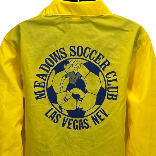 Dunbrooke Women's Soccer Yellow Jacket with Meadows Soccer Club graphic on back