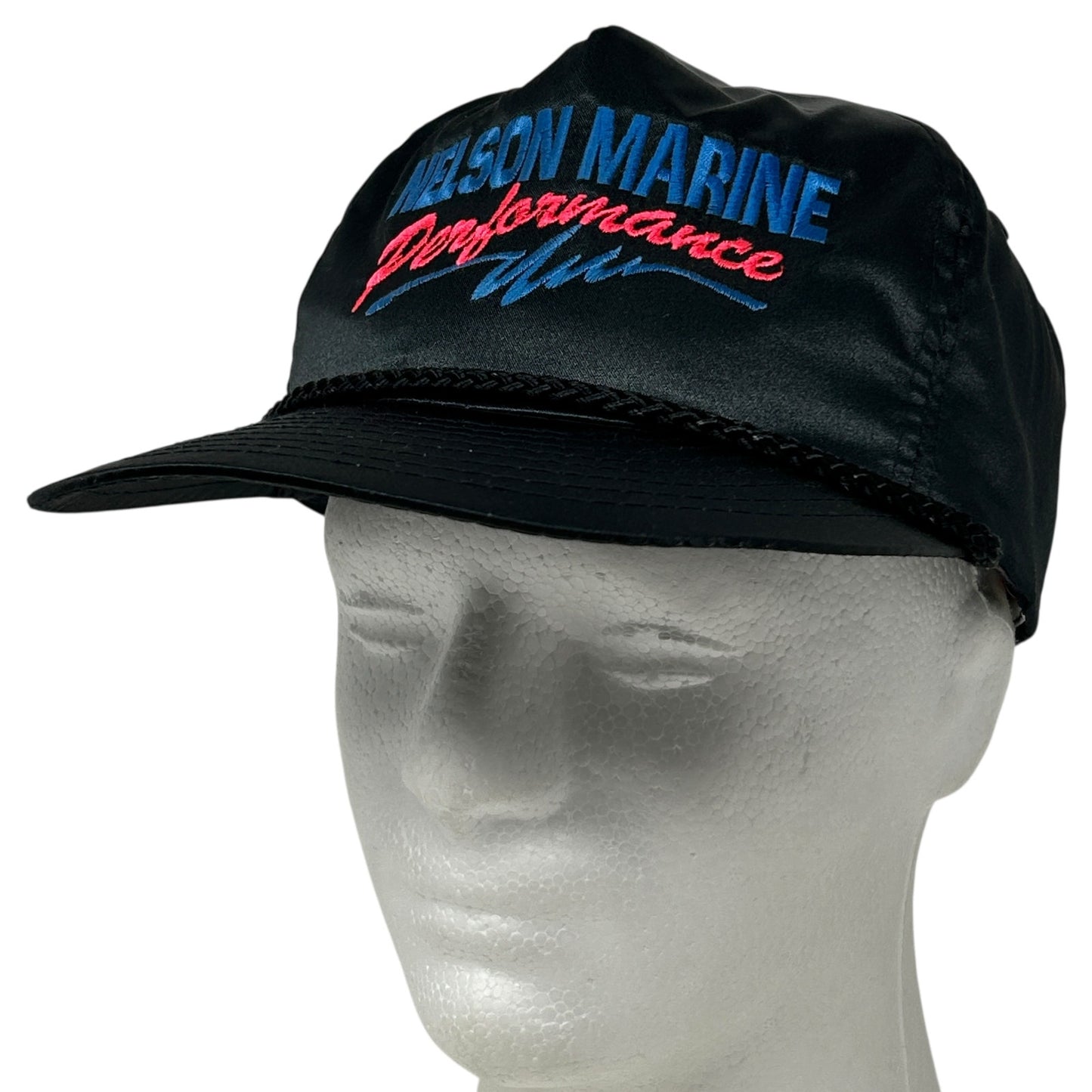 Black Nissin cap featuring 'NELSON MARINE' logo on the front, ideal for outdoor activities.