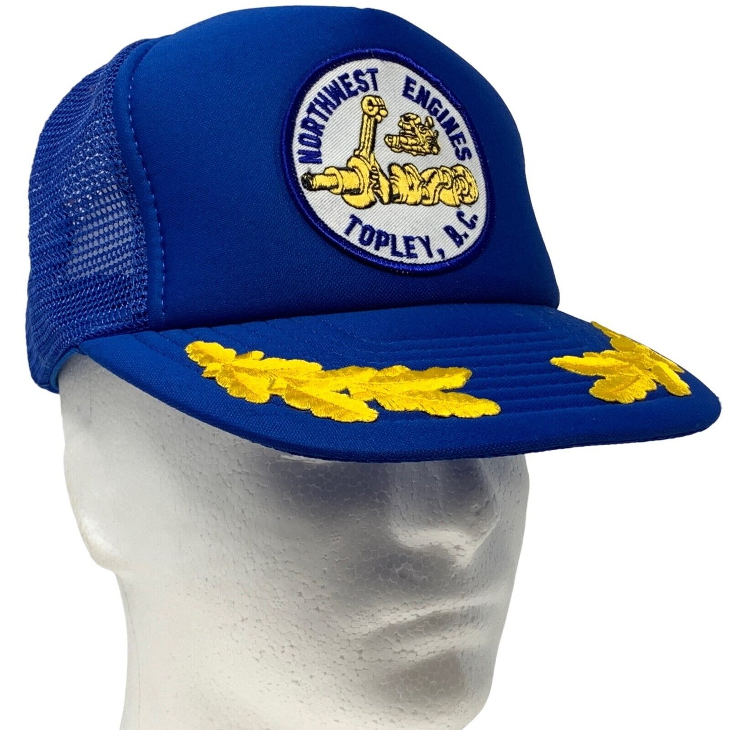 Vintage blue trucker hat with Northwest Engines logo and yellow leaf design on the visor