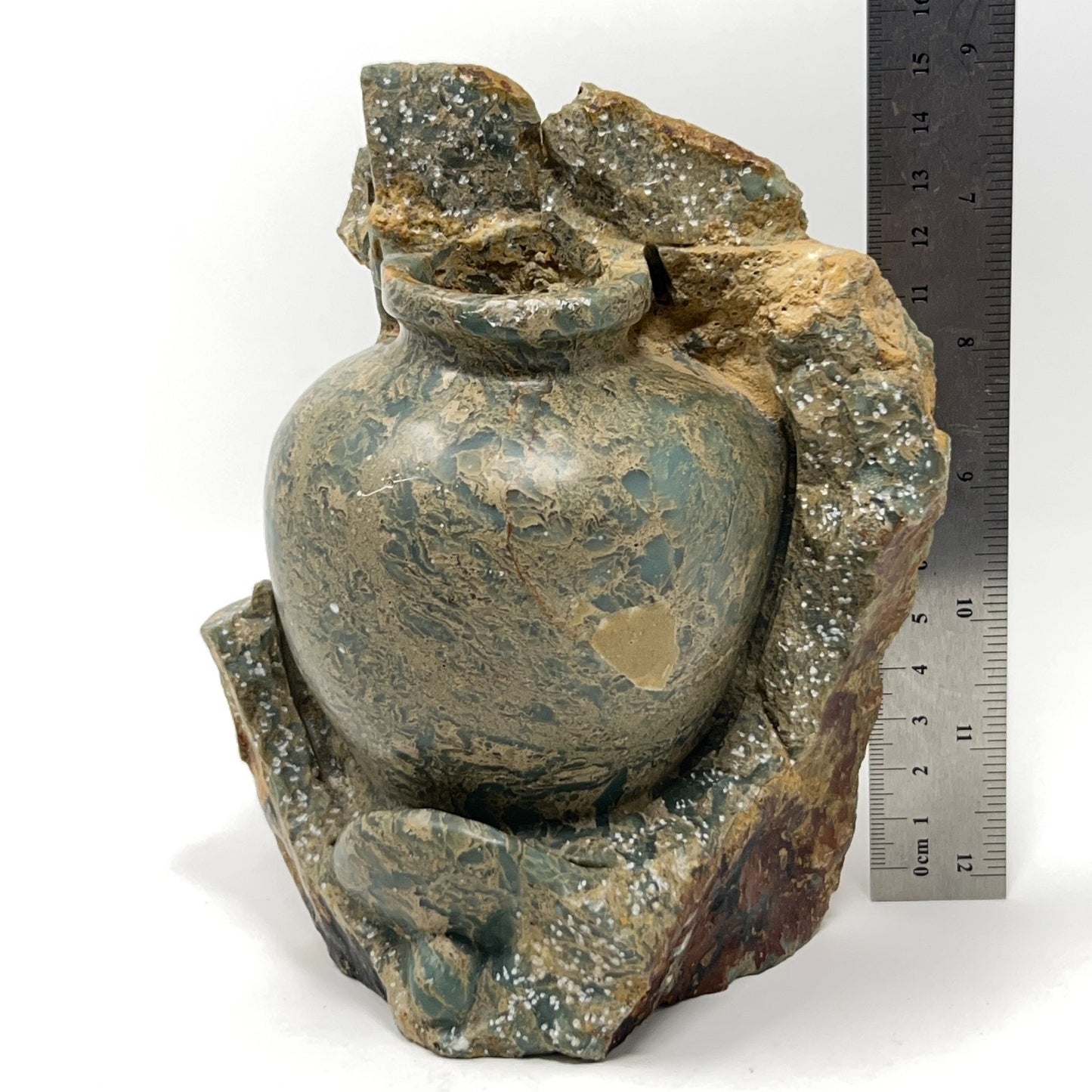 Unbranded vintage stone vase in green with textured design and natural stone base