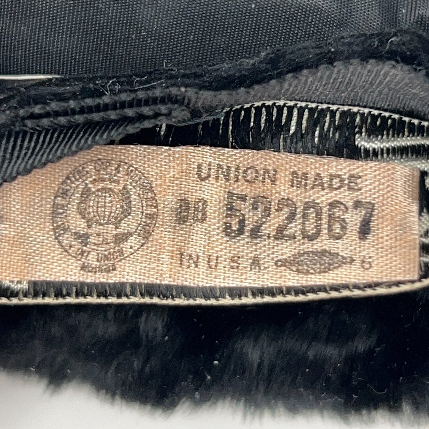 Saks Fifth Avenue 1960s black pillbox hat, front view with tag detail, classic and elegant style