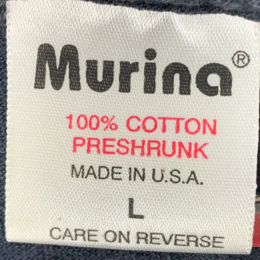 Detailed Murina T-Shirt Tag showcasing 100% cotton fabric, part of the Murina T-Shirt Tag History