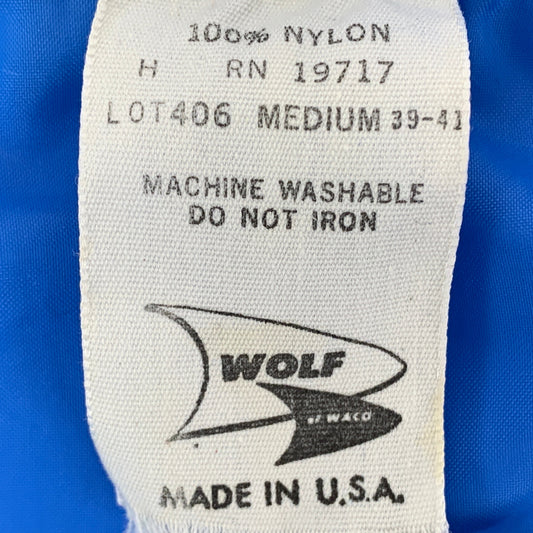 Vintage Miscellaneous Brands T-Shirt Tag History showcasing a 100% nylon care label from Wolf of Waco