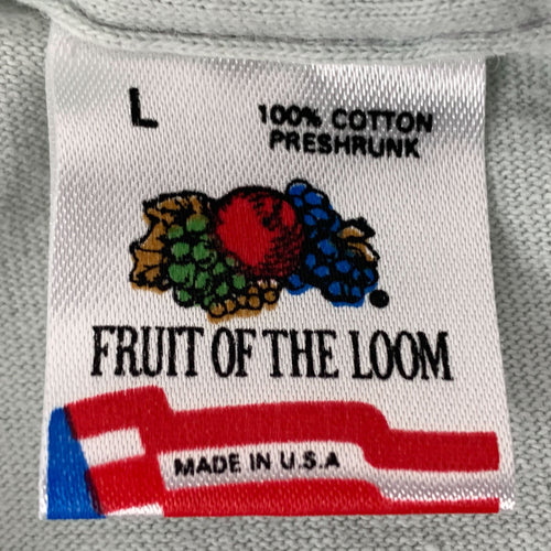 Close-up of a vintage Fruit Of The Loom t-shirt tag showcasing its history and authentic design