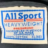 Close-up of a vintage All Sport t-shirt tag highlighting its detailed All Sport T-Shirt Tag History