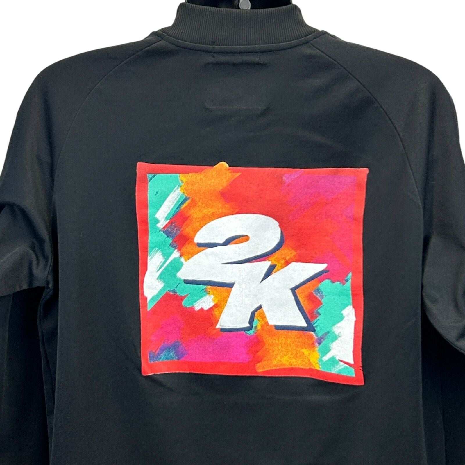 Black New Era Jacket featuring a colorful 2K Video Games logo on the back for a stylish look