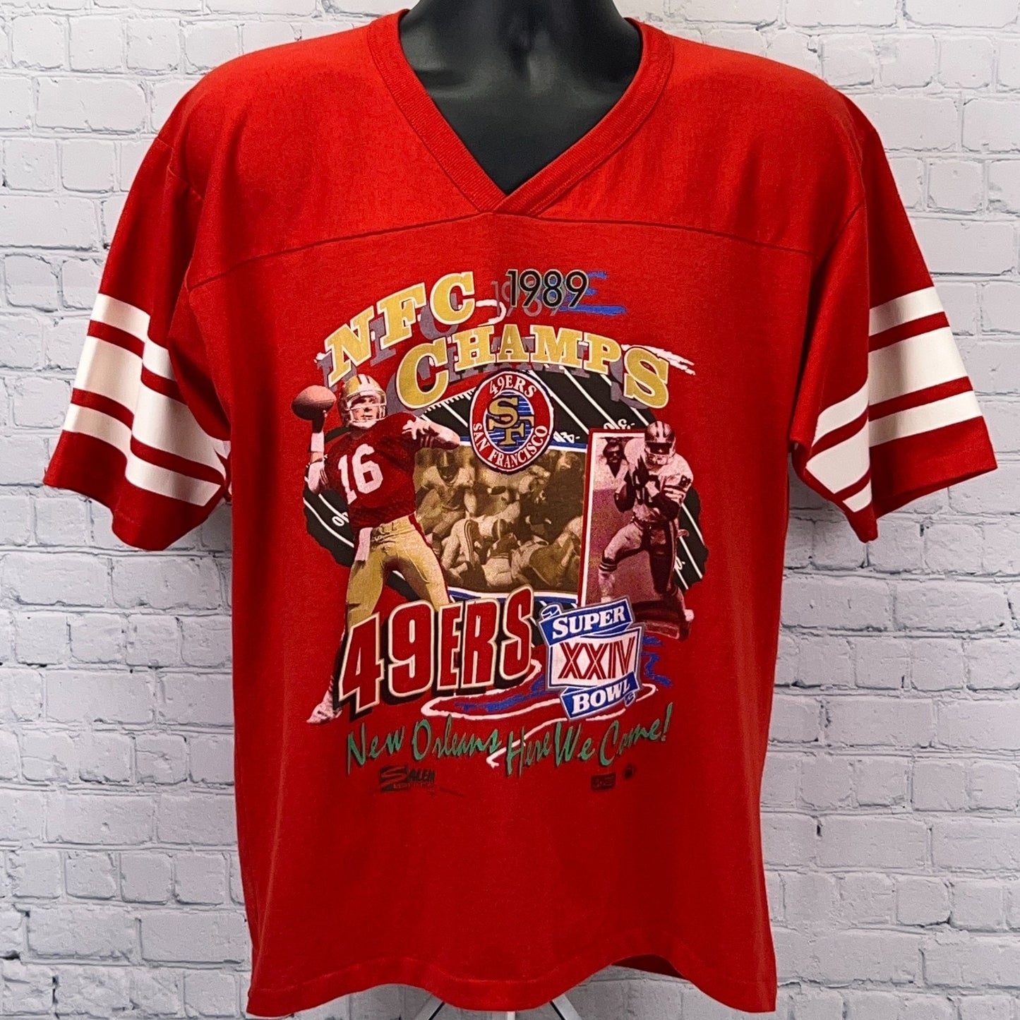 Vintage red 49ers NFC Champs shirt featuring bold graphics and stripes on sleeves, size large, front view