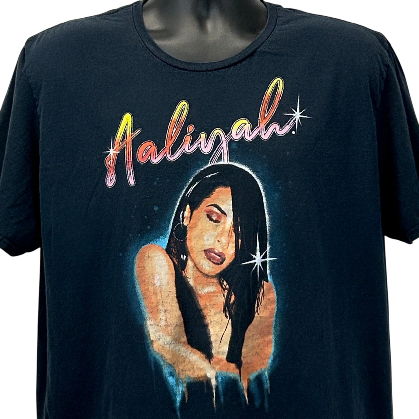 Black Aaliyah T-Shirt featuring colorful graphic of Aaliyah on the front, unisex fit