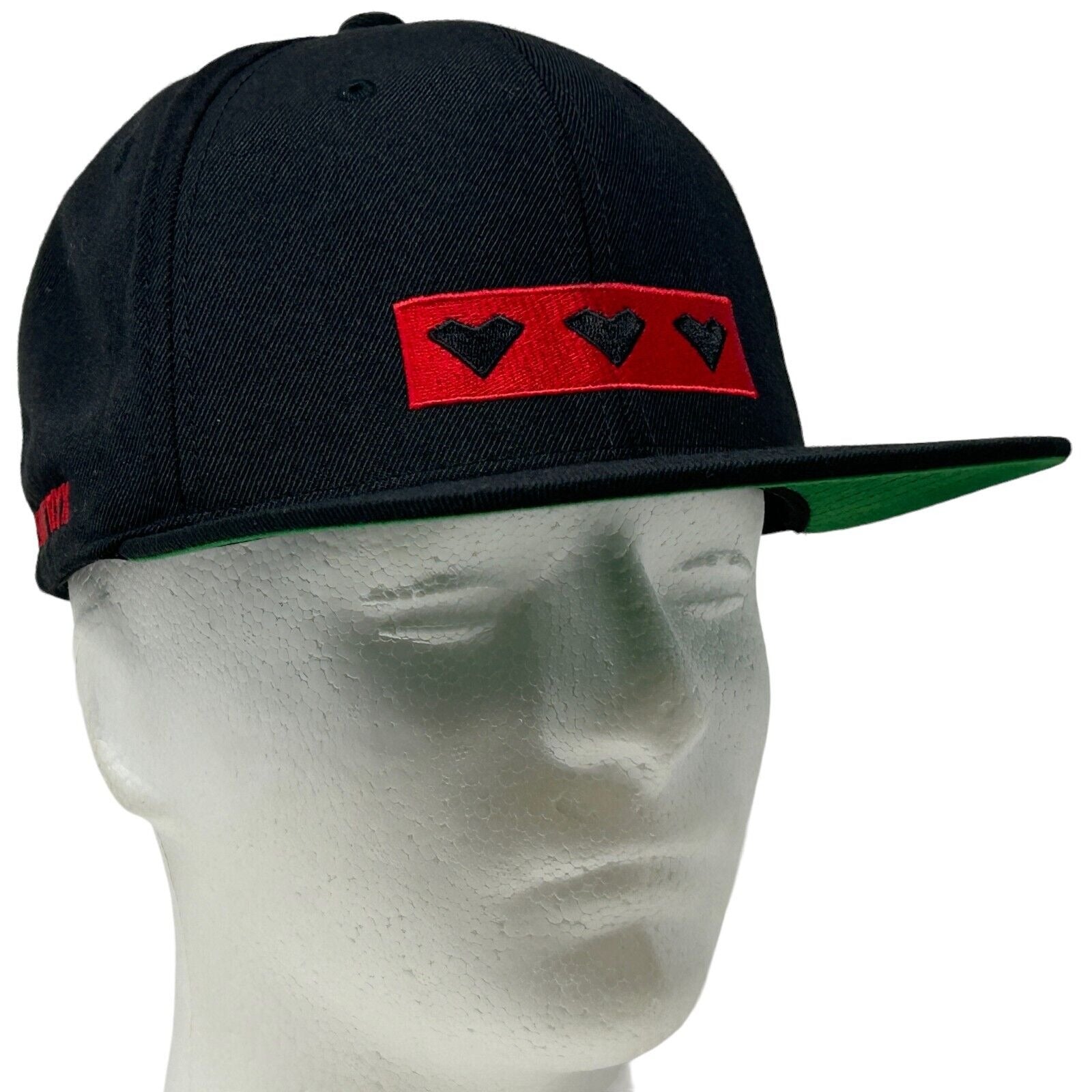 Black Yupoong Absolut Snapback Hat with Red Heart Logo on Front and Green Underbill