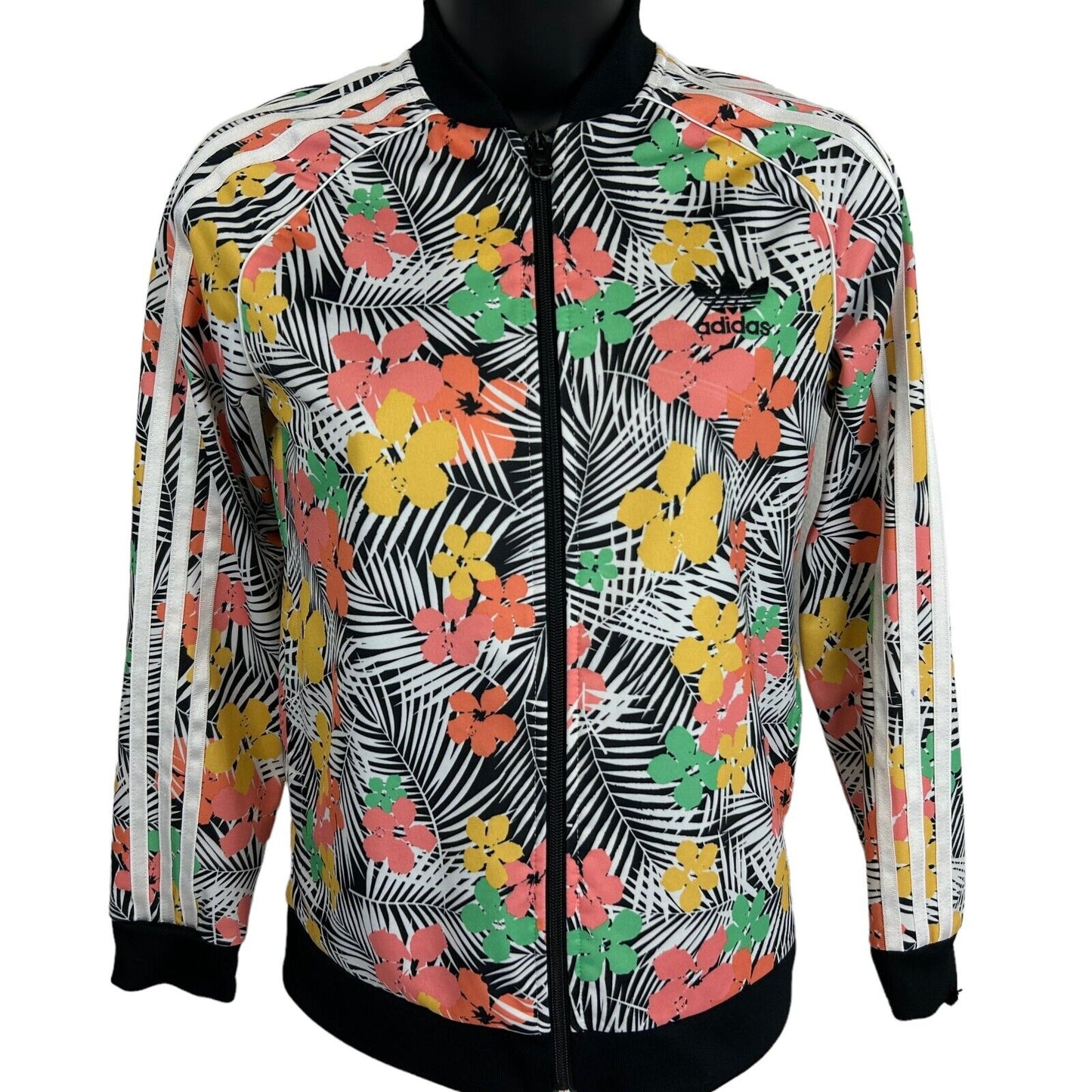 Adidas floral print jacket in black, featuring a front view and vibrant colors with logo details