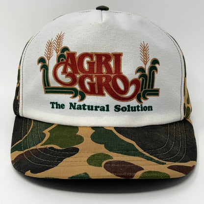 Vintage camo baseball cap featuring Agri Gro logo, front view, with the phrase 'The Natural Solution'