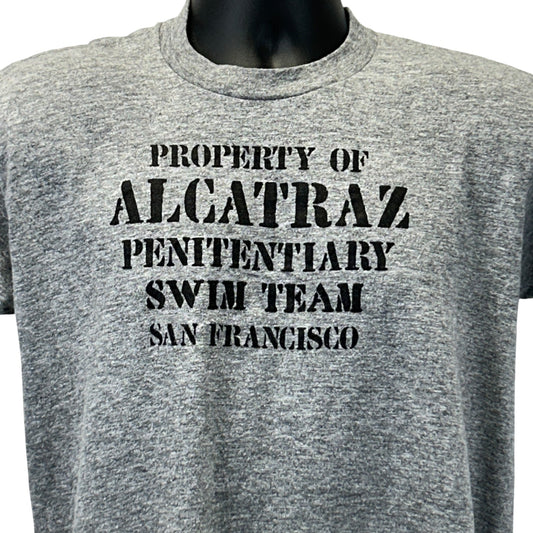 Gray Vintage T-Shirt featuring 'Property of Alcatraz Penitentiary Swim Team' text in bold, front view