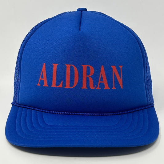 Front view of a vintage blue trucker hat cap featuring the word ALDRAN in red lettering