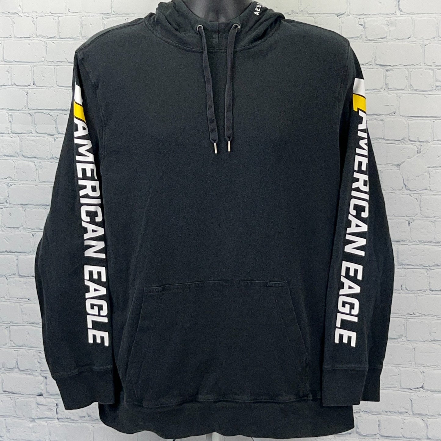 Front view of black American Eagle hoodie with logo on sleeves and drawstring hood in size large