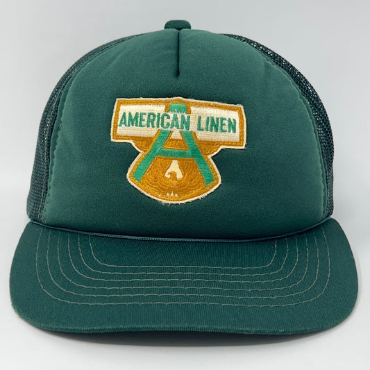 Front view of Vintage Green Trucker Hat featuring American Linen logo, adjustable size for comfort