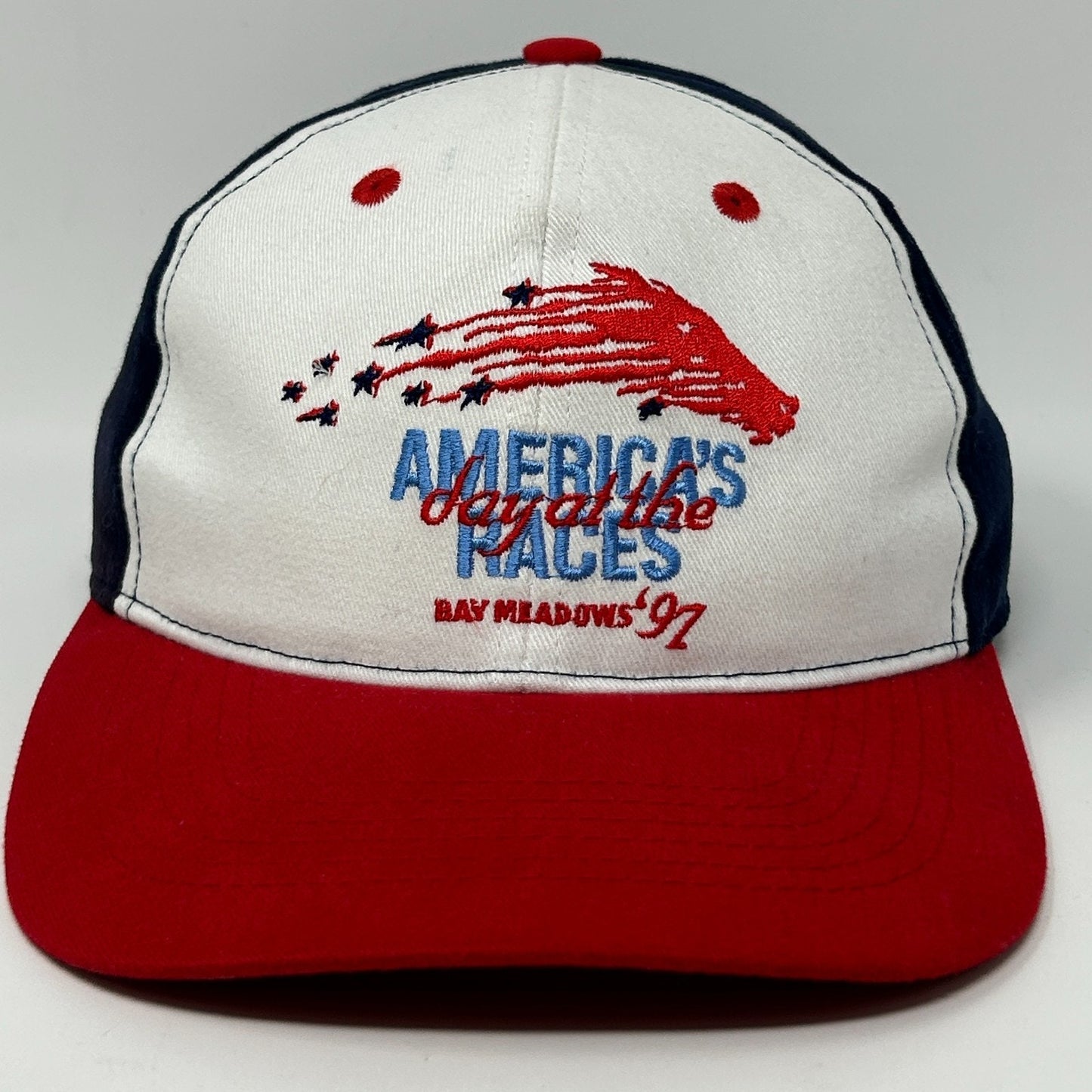 Vintage horse racing cap in white and red with a graphic and logo, featuring a front view design