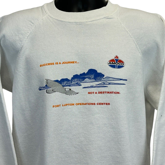 White Hanes sweatshirt featuring Amoco Fort Lupton logo with a graphic design on the front