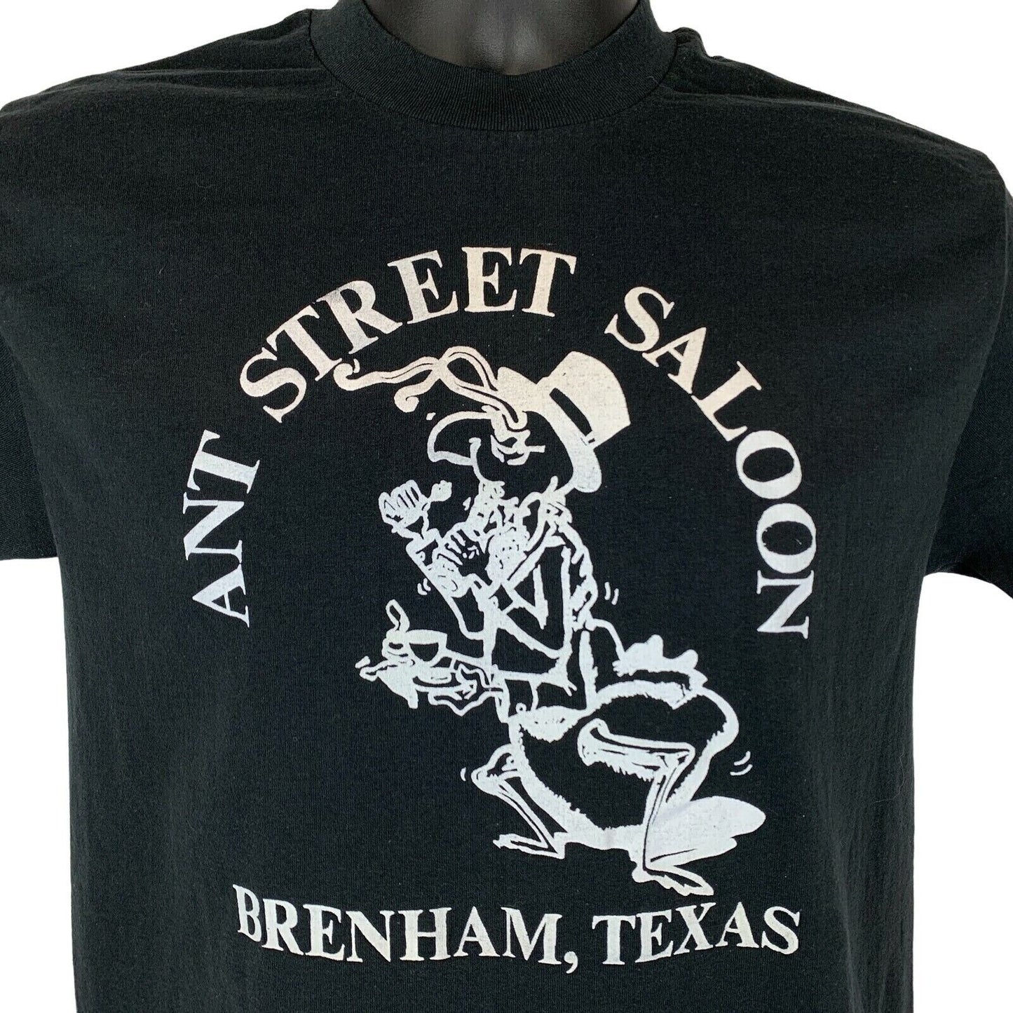 Black Tee Jays T-shirt featuring Ant Street Saloon graphic, size medium with Brenham Texas design on the front