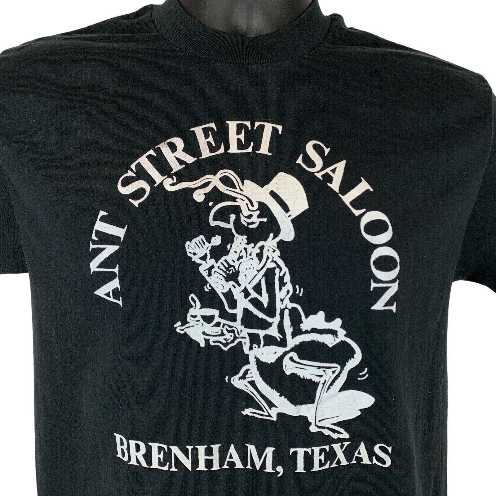 Black Tee Jays T-shirt featuring Ant Street Saloon graphic, size medium with Brenham Texas design on the front