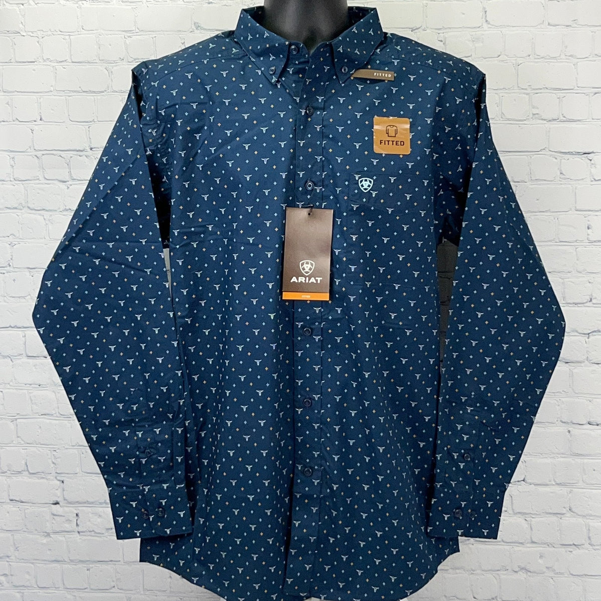 Ariat navy blue fitted long-sleeve shirt with white pattern, front view showing logo tag