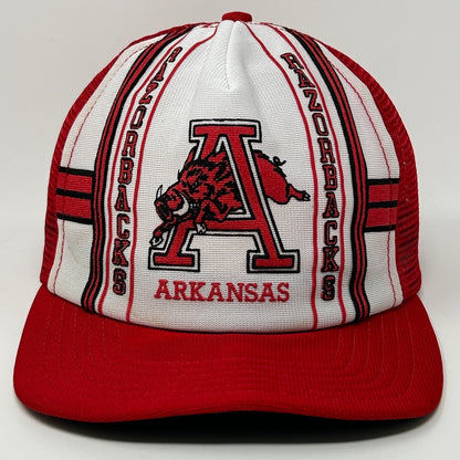 Front view of a red and white Arkansas Razorbacks Hat with logo and bold stripe design