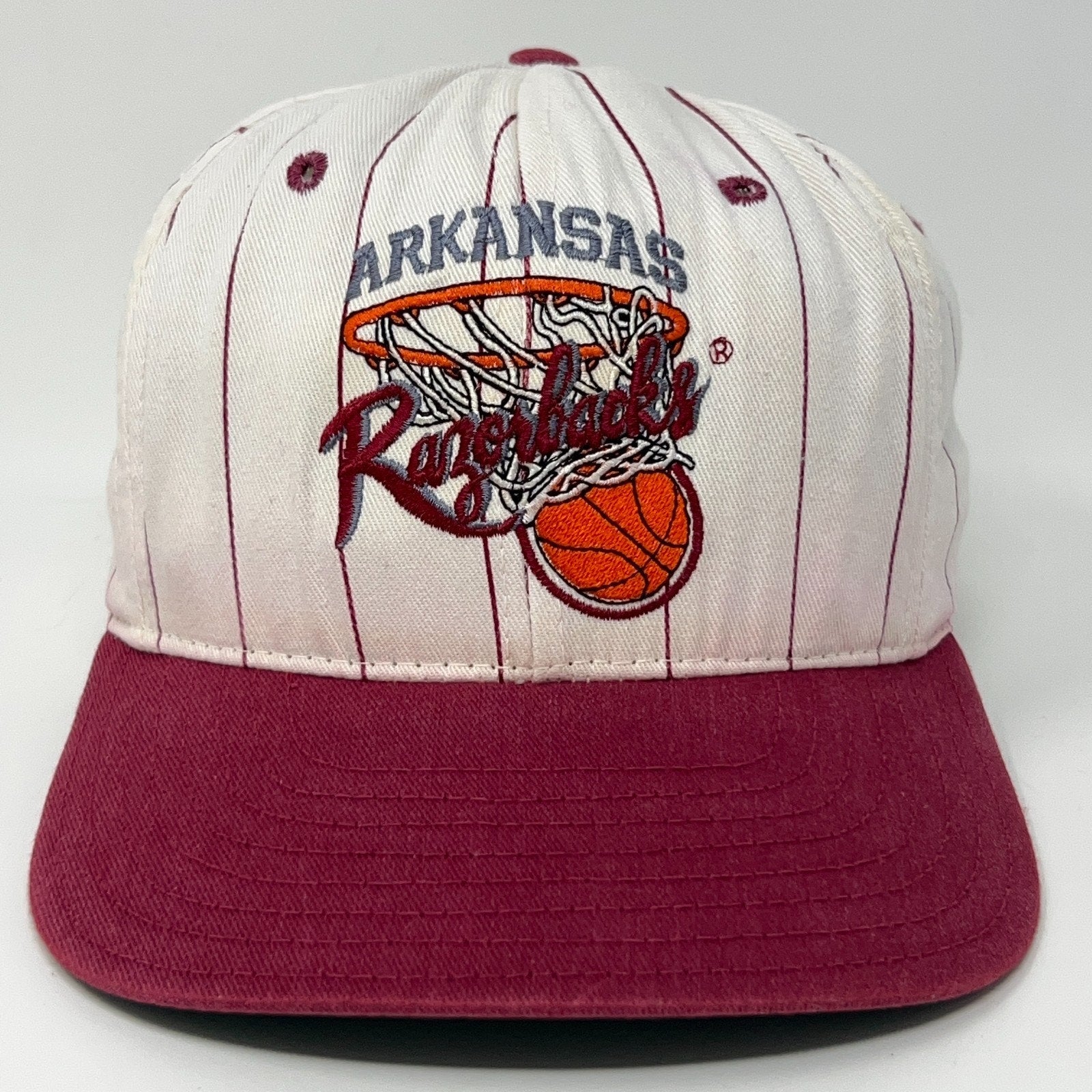 Front view of Vintage Arkansas Razorbacks baseball cap in cream and maroon with embroidered logo