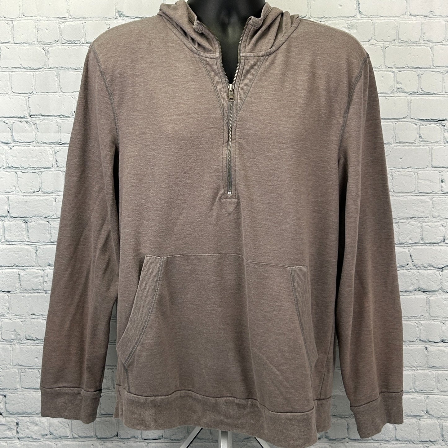 Front view of a taupe Armani Exchange Hoodie with a half-zip and front pockets for casual comfort.
