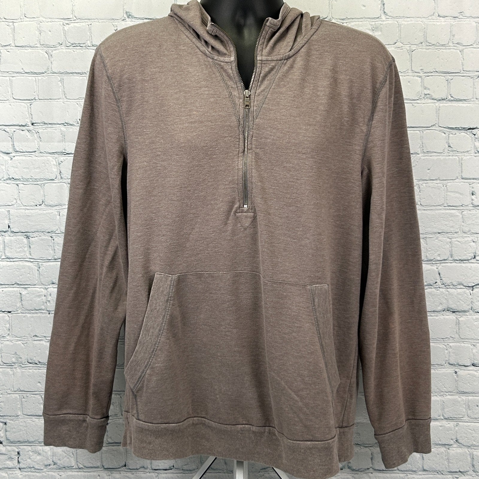 Front view of a taupe Armani Exchange Hoodie with a half-zip and front pockets for casual comfort.