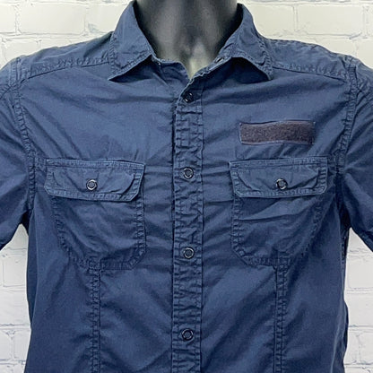 Navy blue Armani Exchange button-up shirt with front pockets and logo detail on the chest