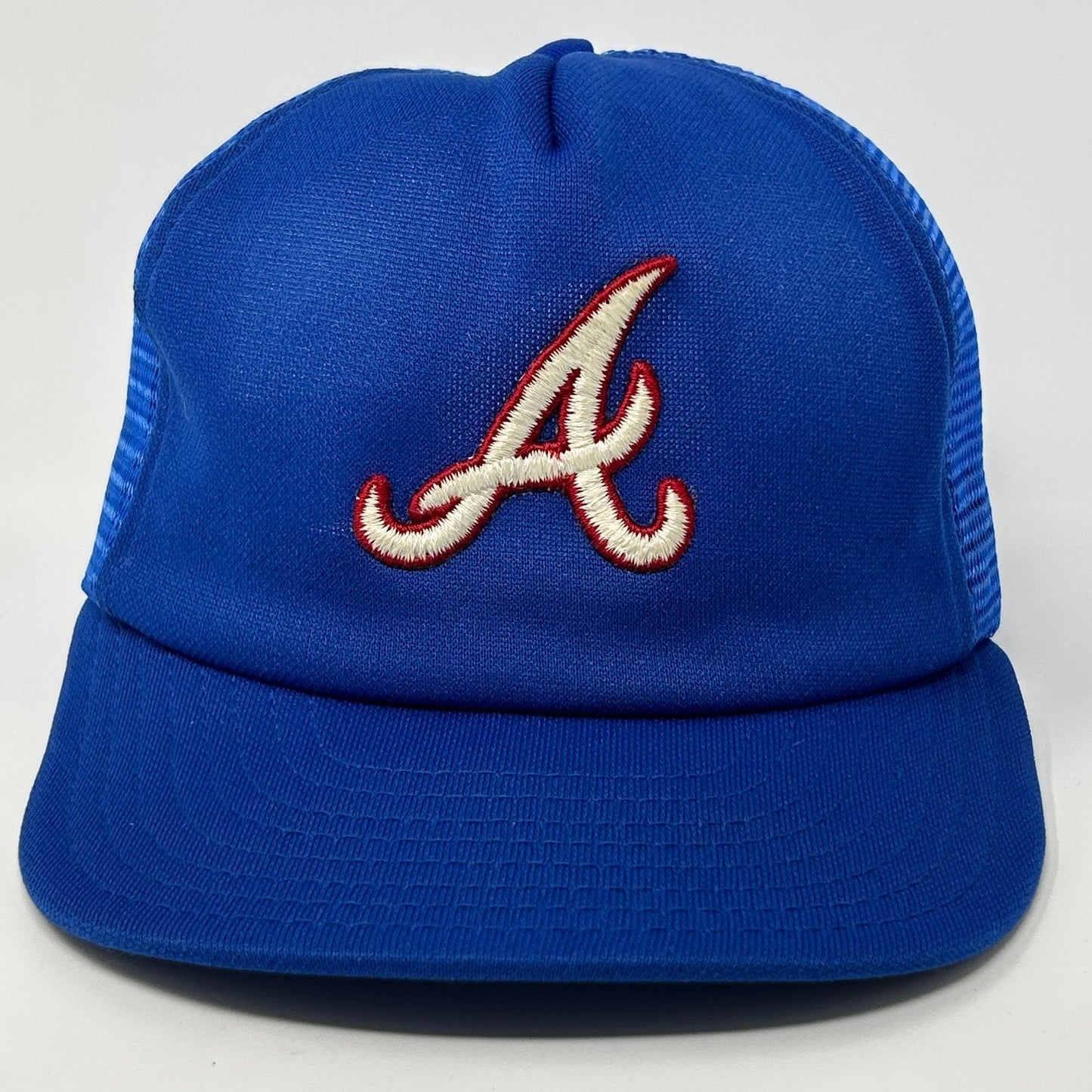 Front view of a blue Atlanta Braves Hat featuring an embroidered logo and mesh sides