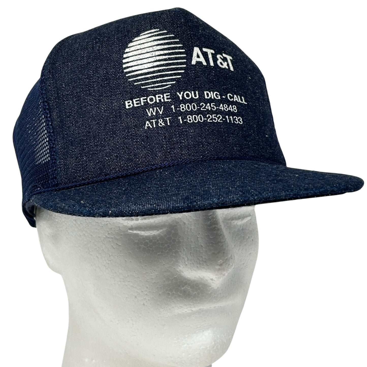 Vintage dark blue AT&T trucker hat with front logo and mesh backing, perfect for casual wear