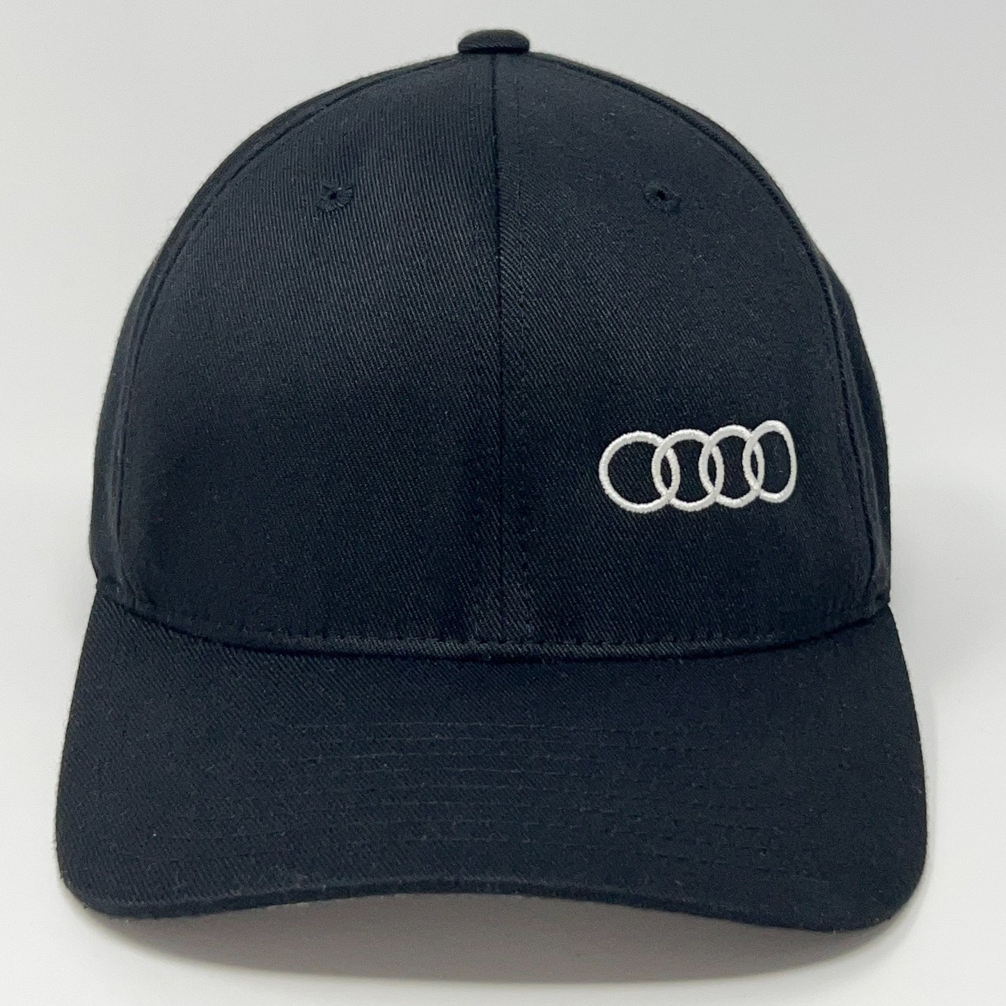 Front view of the Flexfit Audi Hat in black featuring the Audi logo in white embroidery