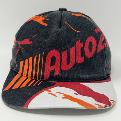 Front view of a Vintage AutoZone cap featuring a colorful splash design in black, red, and orange.