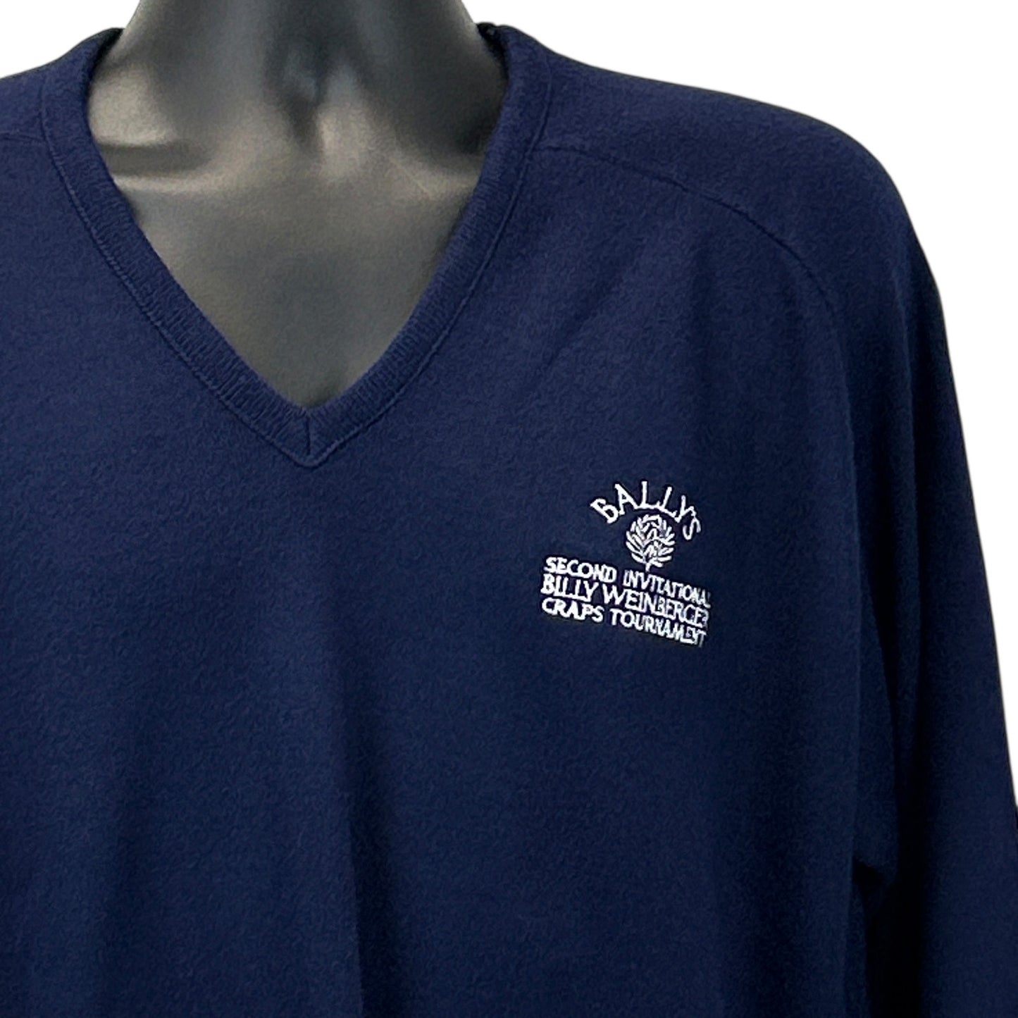 Navy sweater from Tourney Sportswear featuring Ballys Craps Tournament logo on the front, size medium