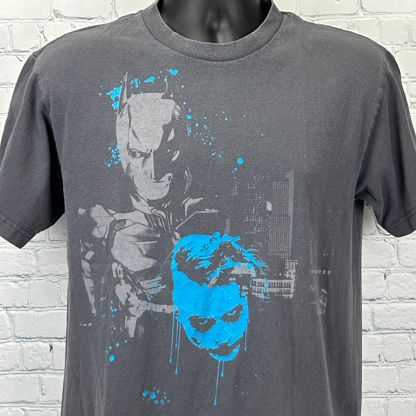 Gray DC Comics T-Shirt featuring Batman and Joker The Dark Knight graphic on the front