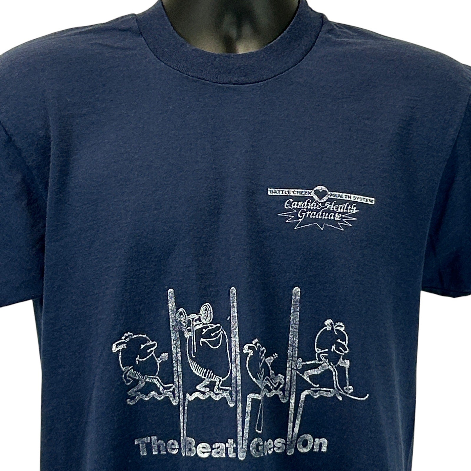 Navy blue Screen Stars T-Shirt with front logo 'Battle Creek Health System' and artistic graphic design