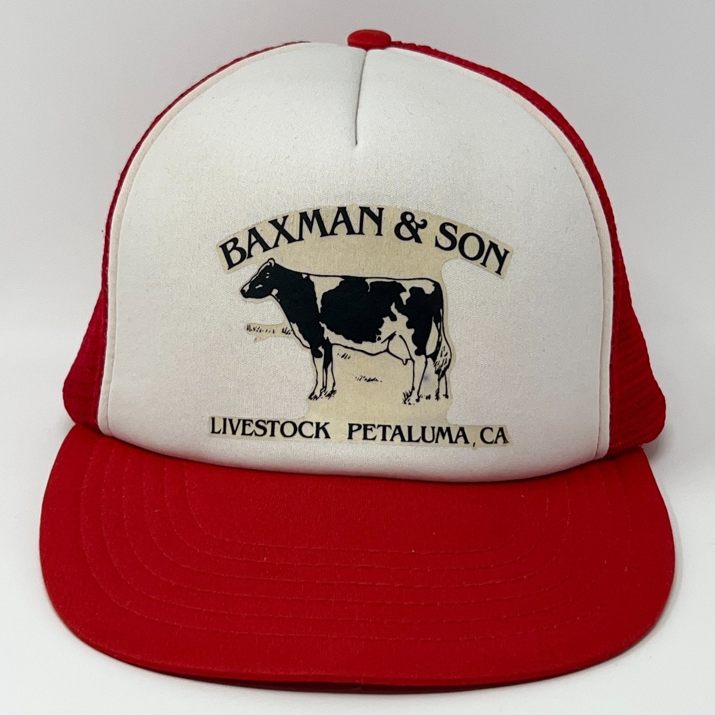 Red Vintage Trucker Hat featuring a cow logo and 'Baxman & Son Livestock Petaluma, CA' text