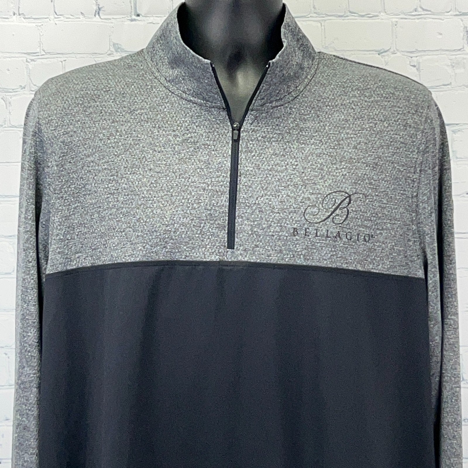 Men's Under Armour Bellagio Shirt in gray and black with half-zip and logo detail on the chest