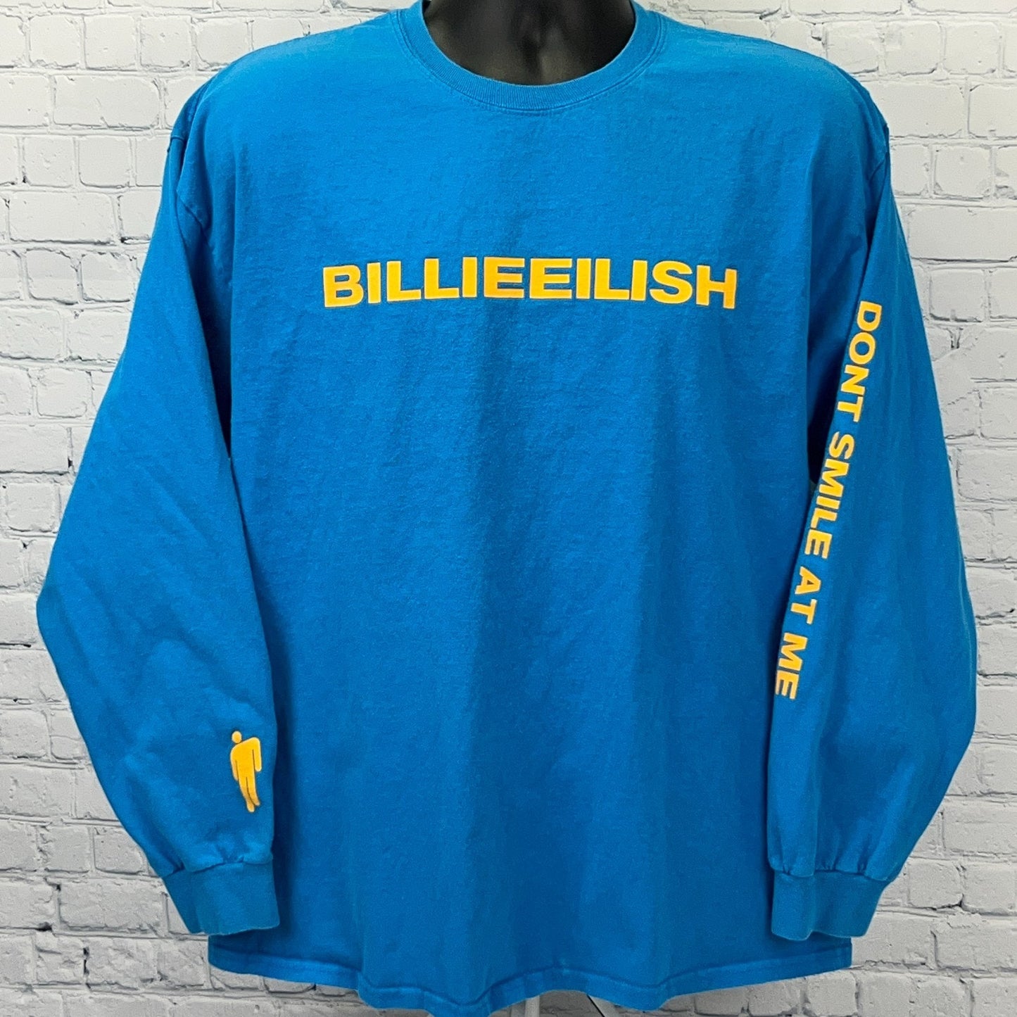 Gildan Billie Eilish long sleeve shirt in blue with yellow logos on front and sleeves