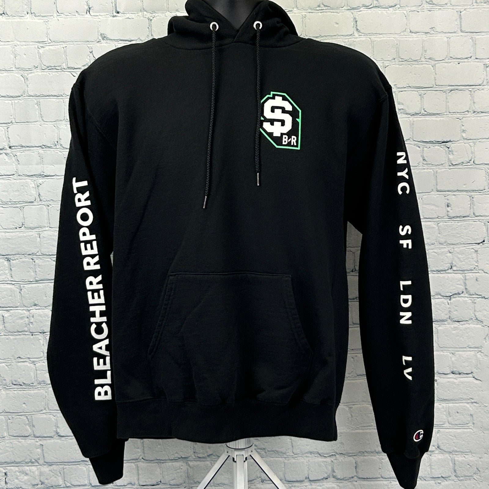 Black Champion Bleacher Report Hoodie with front pocket and logo detail on sleeves, available in various sizes