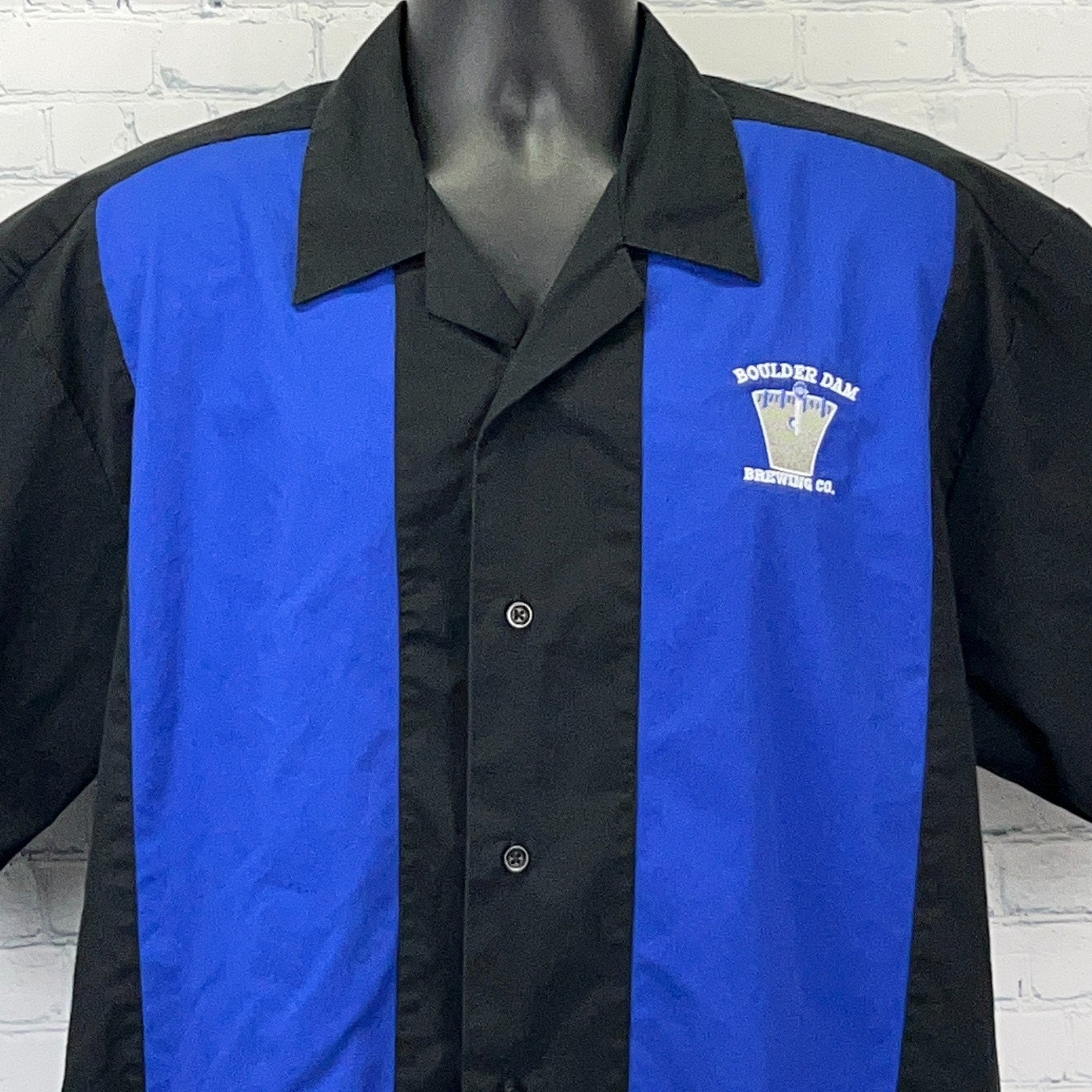Men's black and blue bowling shirt featuring Boulder Dam Brewing Co. logo on the chest