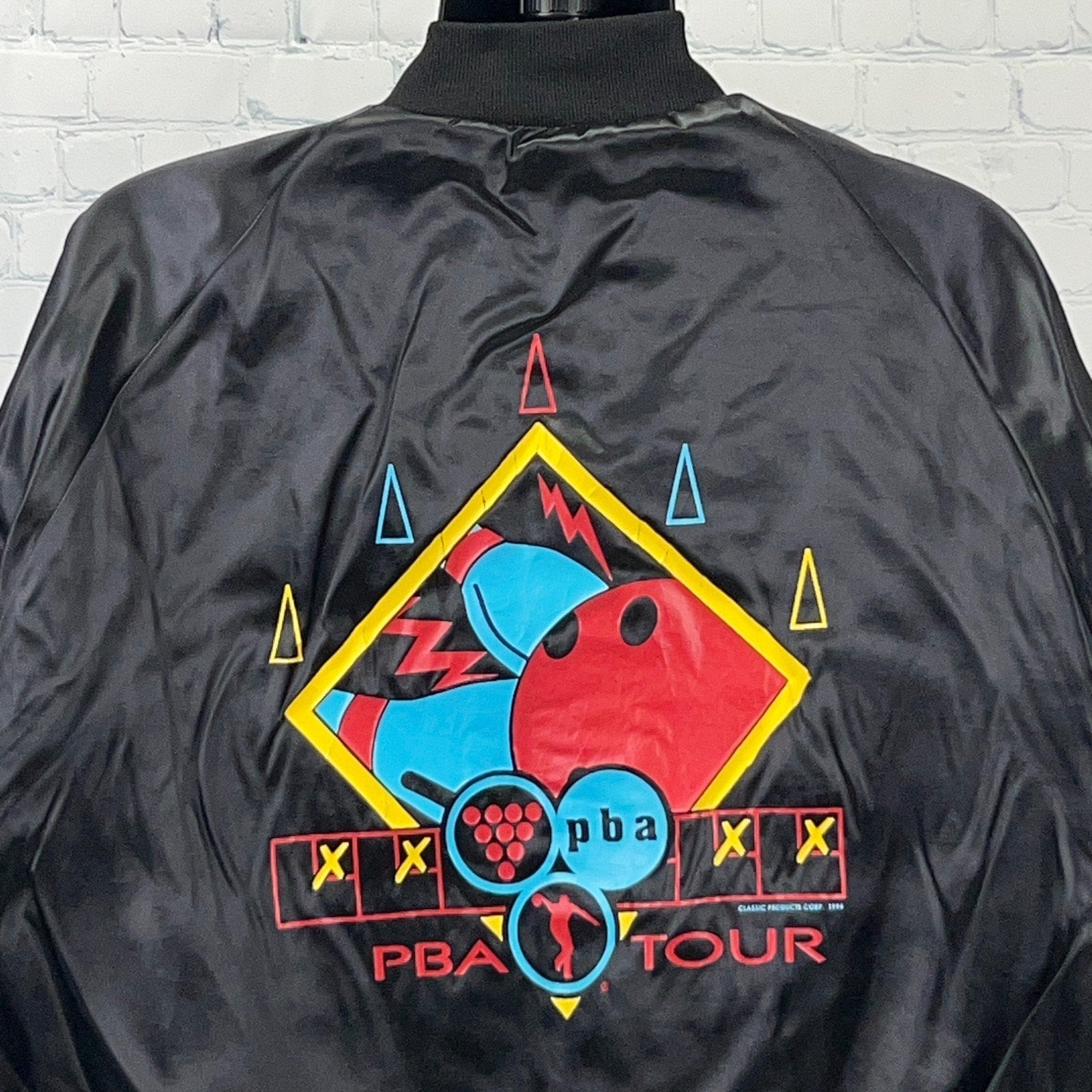 Dunbrooke black bowling jacket featuring colorful PBA Tour graphic on the back, size medium