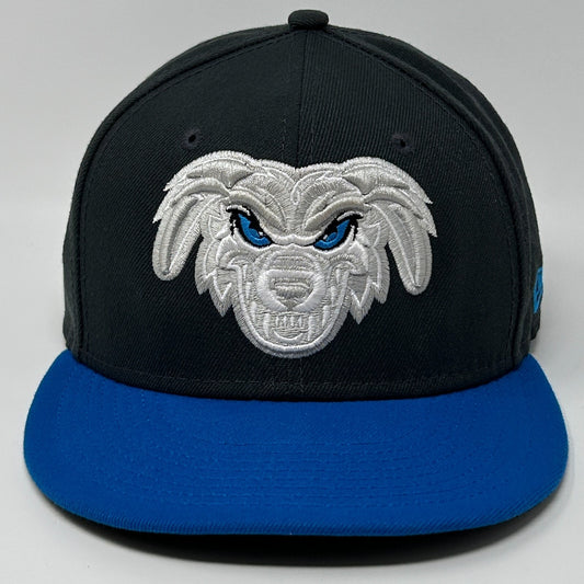 New Era baseball hat in black and blue with an embroidered wolf logo on the front