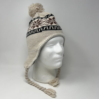 Unbranded beige beanie with pom-pom, ear flaps, and tribal pattern, shown on a mannequin head