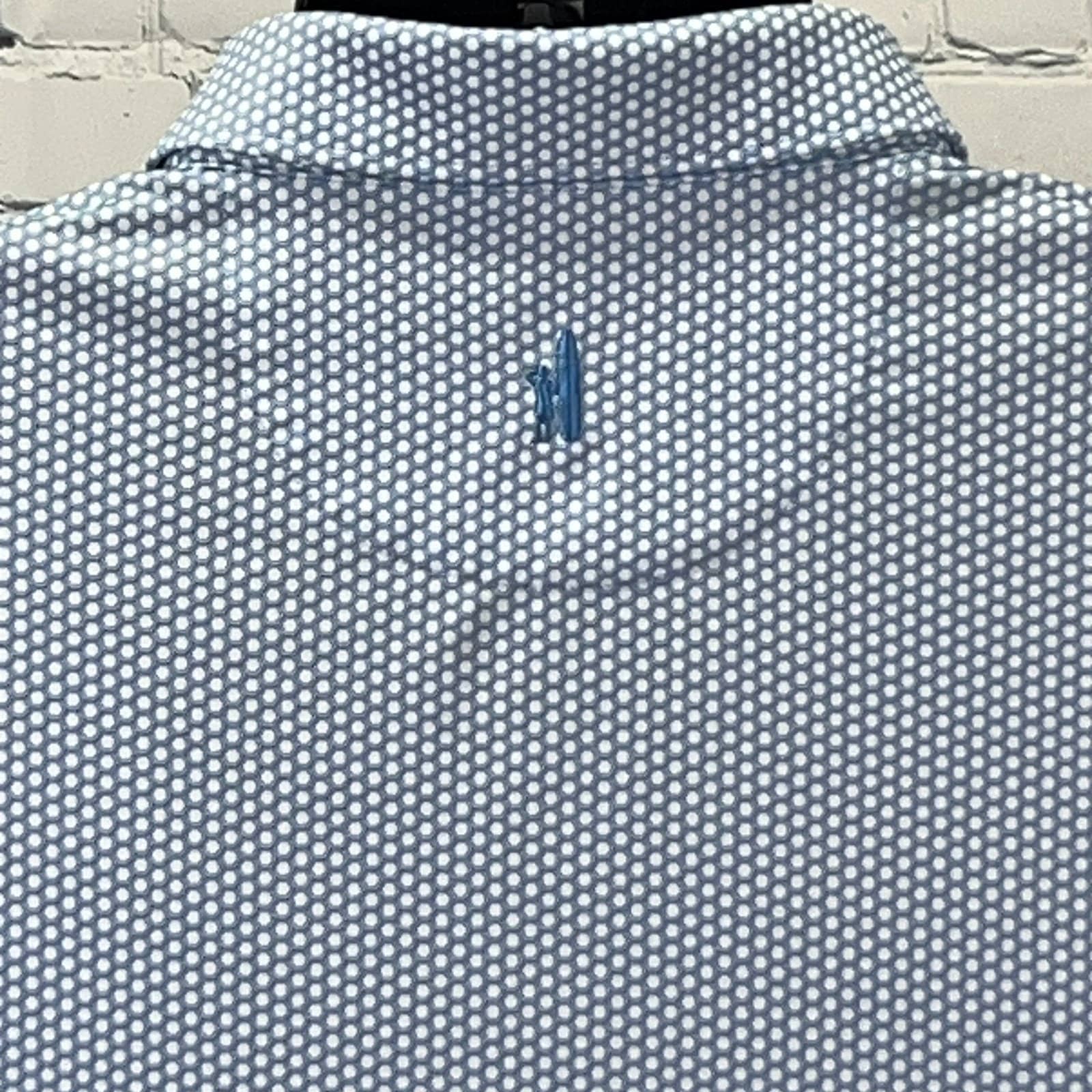 Johnnie-O shirt and polo in light blue with a dotted pattern, back view