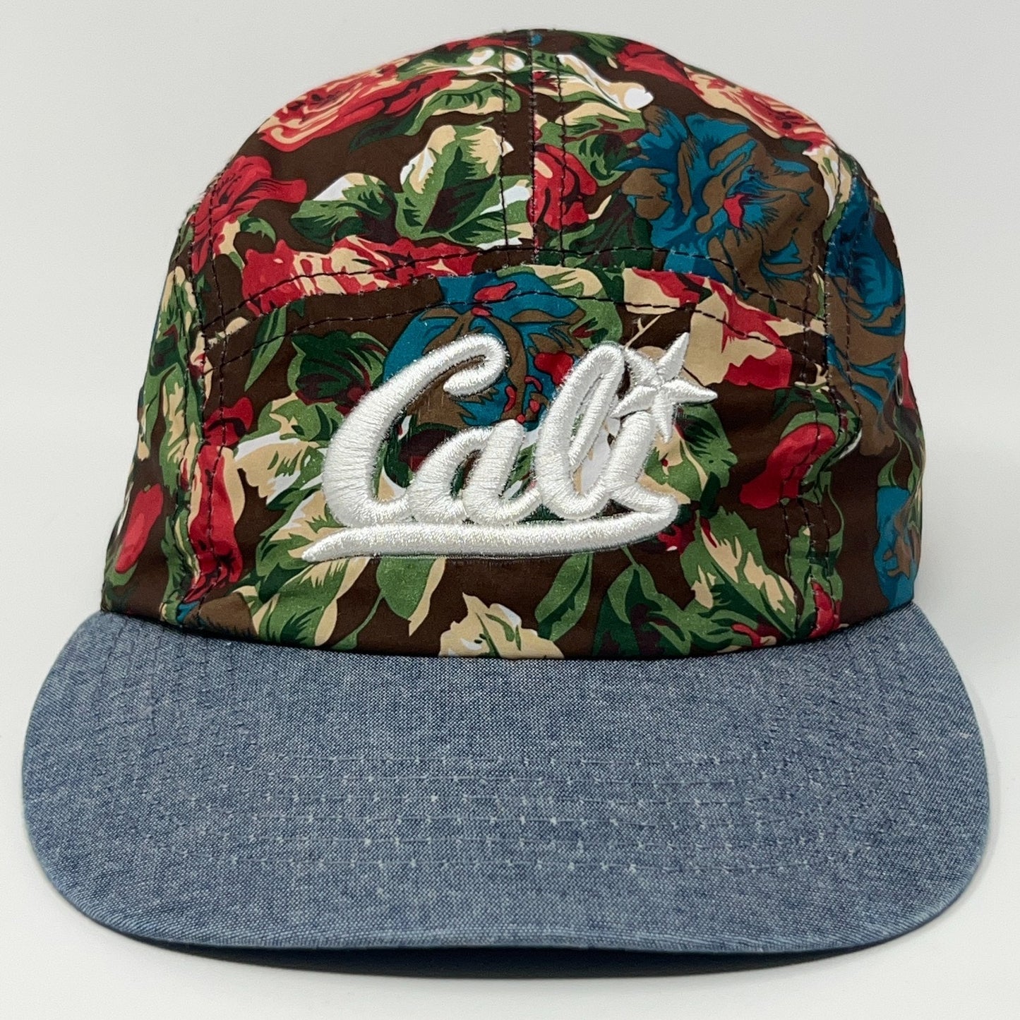 California Floral Cap featuring embroidered Cali logo on front with denim brim and colorful floral pattern